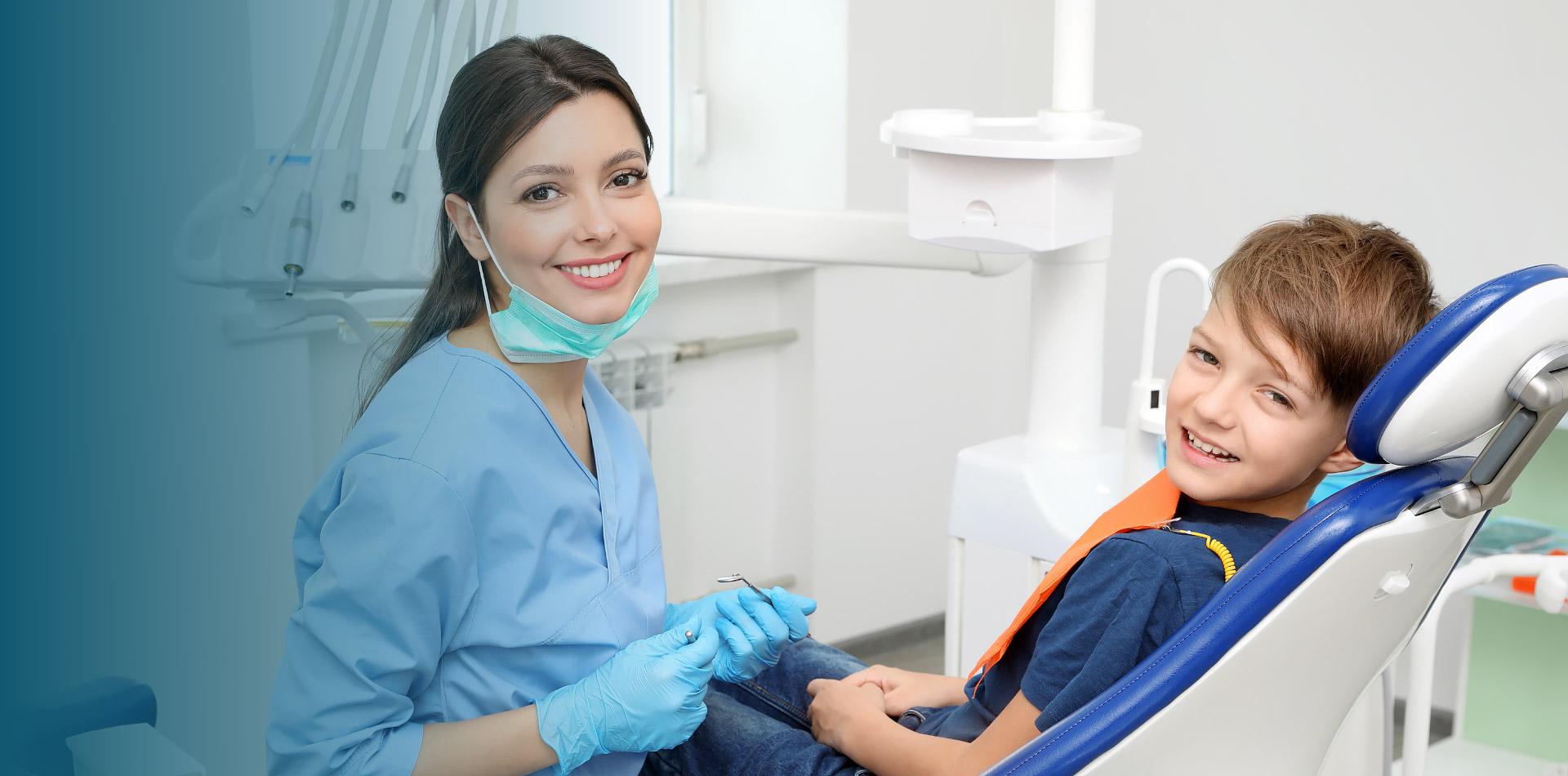 A dentist is with a patient.
